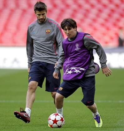 FUSSBALL - CL, Barcelona vs Manchester LONDON,ENGLAND,27.MAI.11 - FUSSBALL - UEFA Champions League, Finale, FC Barcelona vs Manchester United, Vorberichte, Abschlusstraining Barcelona. Bild zeigt Gerard Pique und Lionel Messi (Barcelona). 