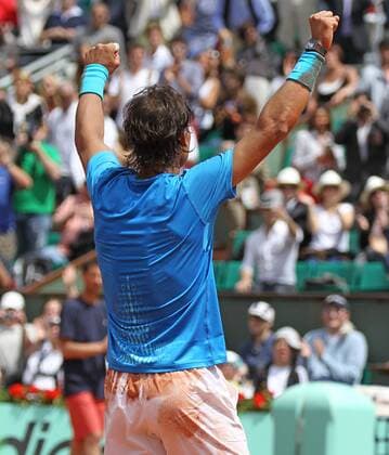 Spaniard Rafael Nadal celebrates after winning his French Open mens third round match at Roland Garros in Paris on May 28, 2011. Nadal defeated Veic 6-1, 6-3, 6-0 to advance to the fourth round.  PAR20110528732