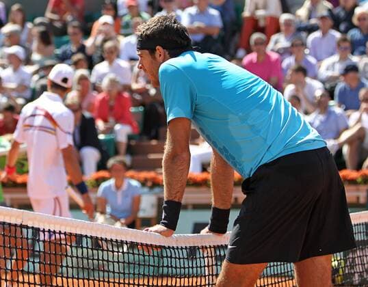 Juan Martin del Potro of Argentina looks over the net after questioning a call during his French Open mens third round match at Roland Garros in Paris on May 28, 2011. Djokovic defeated del Potro 6-3, 3-6, 6-3, 6-2 to advance to the fourth round.  PAR20110528754
