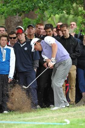 28.05.2011 Wentworth, Surrey, England. Lee Westwood (ENG) plays from the trees during Round 3 of the BMW PGA Golf Herren Golf Championship from Wentworth. xKevinxBatchelorx  ActionPlus11175633 Content restricted for UK based newspaper