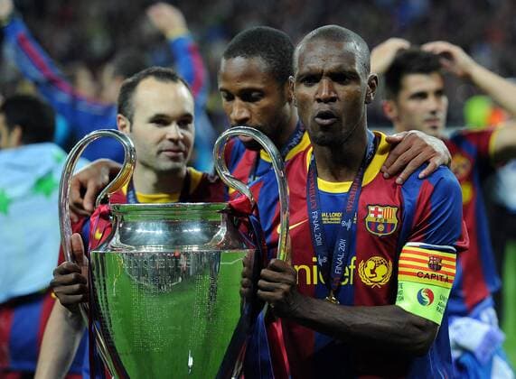 Football - UEFA Champions League Final - Barcelona vs. Manchester United - Barcelona celebrates, LtR Andres Iniesta, Seydou Keita, Eric Abidal with the trophy at Wembley Stadium, London 