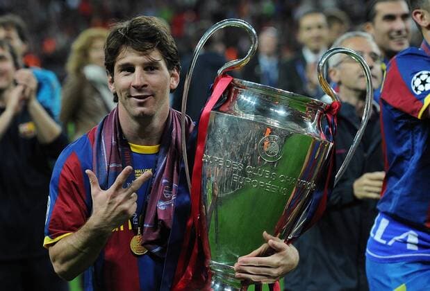Football - UEFA Champions League Final - Barcelona vs. Manchester United Lionel Messi of Barcelona celebrates with the trophy at Wembley Stadium, London 
