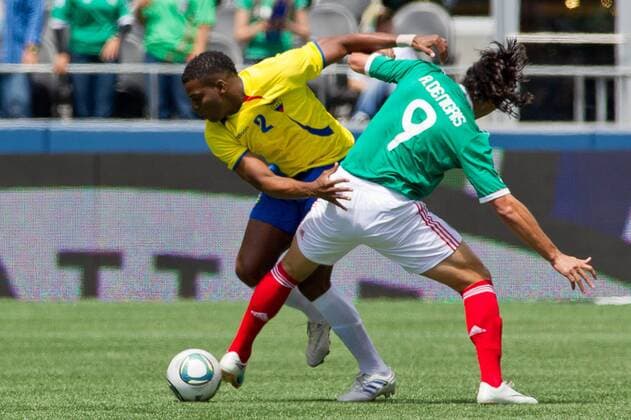 May 28, 2011 - Seattle, Washington, U.S - Ecuador defender Giovanni Caicedo (2) pushes Mexico forward Aldo De Nigris (9) to the side at Qwest Field in Seattle, Washington. The game ended in a 1-1 tie. FMF U.S. Tour 2011 - May 28 - Ecuador at Mexico - ZUMAy19