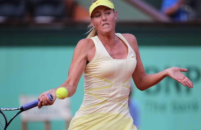 Maria Sharapova of Russia returns the ball during their women s singles round of 16 match at the French Open tennis championship at the Roland Garros stadium in Paris --- 