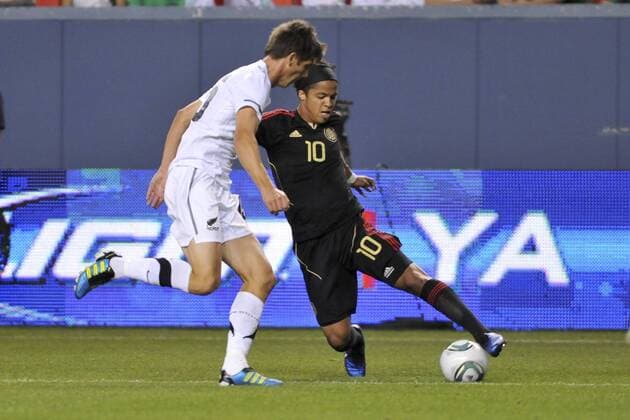 June 1, 2011 - Denver, Colorado, United States of America - Mexico s Giovani Dos Santos (10) tries to go around a New Zealand defender at Invesco Field at Mile High. Mexico defeated New Zealand 3-0 FMF U.S. Tour 2011 - May 28 - New Zealand vs Mexico - ZUMAx04