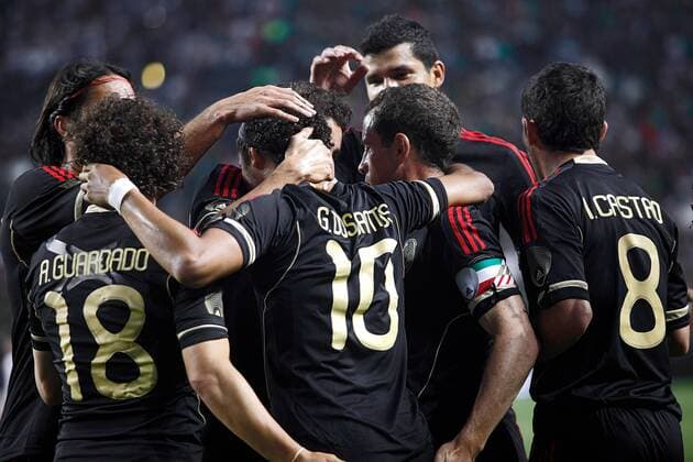 June 1, 2011: 8:29:53 PM - Mexico s Giovani Dos Santos ( 10) is surrounded by teammates after scoring against New Zealand during their friendly as part of the 2011 FMF U.S. Tour at Invesco Field in Denver, Co. Mexico won the match 3-0. Dos Santos had two goals in the victory. SOCCER: JUN 01 Mexico v New Zealand Icon14111060116 EDITORIAL USE ONLY