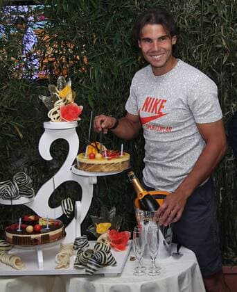 Rafael Nadal (ESP) receives a birthday cake on his 25th birthday after winning his French Open mens semifinal match at Roland Garros in Paris on June 3, 2011.  PAR20110603743