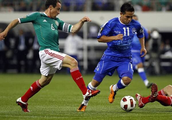 05 June 2011: El Salvador forward Rodolfo Zelaya (11) and Mexico midfielder Gerardo Torrado (6) during the first half of Mexico vs. El Salvador in the first round of the CONCACAF Gold Cup game played at Cowboys Stadium in Arlington, TX. There is no score. SOCCER: JUN 05 CONCACAF Gold Cup - First Round - Mexico v El Salvador Icon1106050030 EDITORIAL USE ONLY
