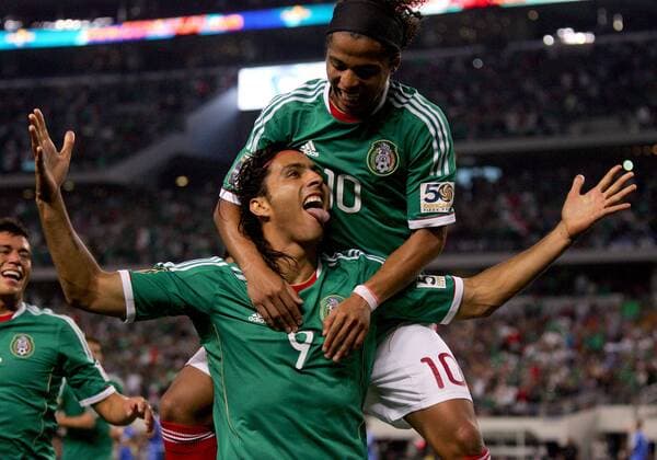 05 June 2011: Mexico forward Jesus De Nigris (9) is hugged by teammate Mexico forward Giovani Dos Santos (10) after scoring Mexico s second goal during the second half of Mexico vs. El Salvador in the first round of the CONCACAF Gold Cup game played at Cowboys Stadium in Arlington, TX. Mexico leads 3-0. SOCCER: JUN 05 CONCACAF Gold Cup - First Round - Mexico v El Salvador Icon1106050051 EDITORIAL USE ONLY