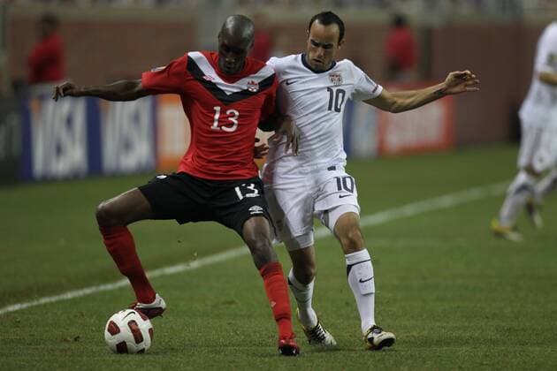 June 7, 2011 - Detroit, Michigan, U.S - Canada midfielder Atiba Hutchinson (13) crosses the ball defended by USA midfielder Landon Donovan (10) during the CONCACAF Gold Cup match at Ford Field. USA defeated Canada 2-0. Soccer: 2011 CONCACAF Gold Cup - June 7 - USA vs Canada - ZUMAx33