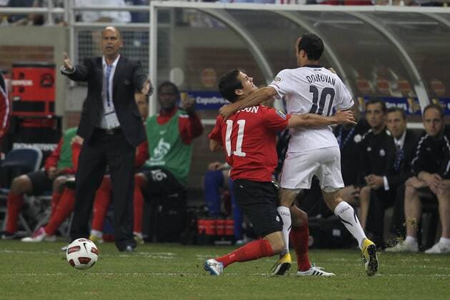 June 7, 2011 - Detroit, Michigan, U.S - USA midfielder Landon Donovan (10) and Canada midfielder Joshua Christopher Simpson (11) goes for the loose ball during the CONCACAF Gold Cup match at Ford Field. USA defeated Canada 2-0. Soccer: 2011 CONCACAF Gold Cup - June 7 - USA vs Canada - ZUMAx33