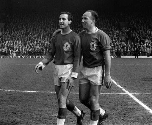 Gerry Byrne and Ronnie Moran (right) Liverpool FC, celebrate winning the League Championship title. Liverpool FC v Arsenal FC. 18 04 1964; Anfield Football 