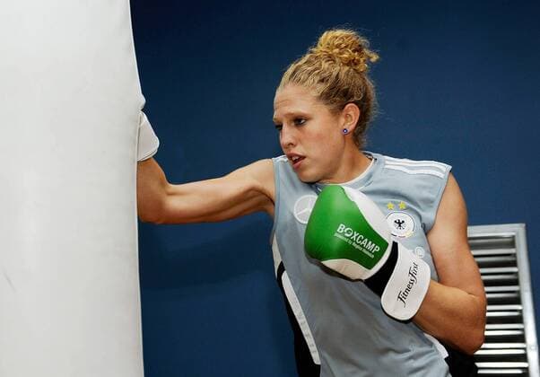 FRANKFURT AM MAIN, GERMANY - JUNE 13: Kim Kulig of German National Football Team is boxing during a Germany training session at Fitness First club on June 13, 2011 in Frankfurt am Main, Germany - 
