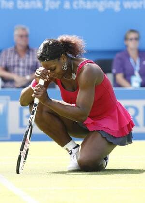 EASTBOURNE, June 15, 2011 -- Serena Williams of the United States reacts during her second-round match in 2011 s AEGON International in Eastbourne, Britain, June 15, 2011. Serena Williams lost 1-2. 