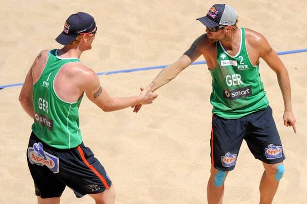 BEACHVOLLEYBALL - FIVB WM 2011 ROM,ITALIEN,18.JUN.11 - DIVERS, BEACH VOLLEYBALL - FIVB Weltmeisterschaften, Herren. Bild zeigt den Jubel von Jonas Reckermann und Julius Brink (GER). 