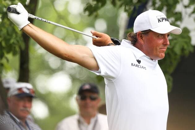 June 18, 2011 - Bethesda, Maryland, UNITED STATES - Phil Mickelson (USA) stretches before he tees off on the 10th hole during the third round of the 2011 U.S. Open at Congressional Country Club. GOLF 2011 - June 18 - US Open Third Round - ZUMAz64