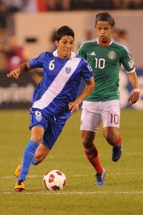 June 18, 2011 - East Rutherford, New Jersey, U.S - Guatemala s Gustavo Cabrera (6) is marked by Mexico s Giovani Dos Santos (10) during second half CONCACAF Gold Cup soccer quarterfinal action where Mexico defeated Guatemala 2-1 at the New Meadowlands Stadium in East Rutherford, N.J. CONCACAF Gold Cup Soccer - June 18 - Mexico vs Guatemala - ZUMAx50