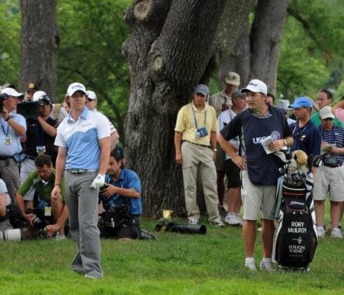 Northern Ireland s Rory McIlroy looks over his options as his ball is in the rough on third hole during the third round of the U.S. Open golf championship at Congressional Country Club in Bethesda, Maryland on June 18, 2011. He scrambled to make par on the hole. McIlroy started the day in first place at 11 under par.  WAP20110618116