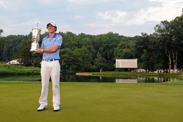 Northern Ireland s Rory McIlroy holds up the trophy after winning the U.S. Open Championship at Congressional Country Club in Bethesda, Maryland on June 19, 2011. McIlroy shot 2-under-par for 69 to finishing the tournament 16-under at 268, setting a new U.S. Open record.  WAP20110619332