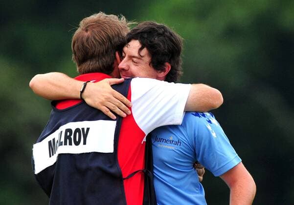 Northern Ireland s Rory McIlroy hugs his caddie J.P. Fitzgerald after winning the U.S. Open Championship at Congressional Country Club in Bethesda, Maryland on June 19, 2011. McIlroy shot 2-under-par for 69 to finishing the tournament 16-under at 268, setting a new U.S. Open record.  WAP20110619325