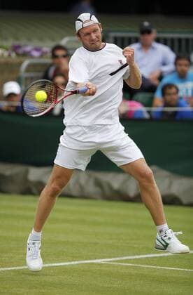 Wimbledon Championships 2011,AELTC,London, ITF Grand Slam Tennis Tournament . Spieler Rainer Schüttler (GER),Einzelbild,Aktion,Ganzkörper,Hochformat