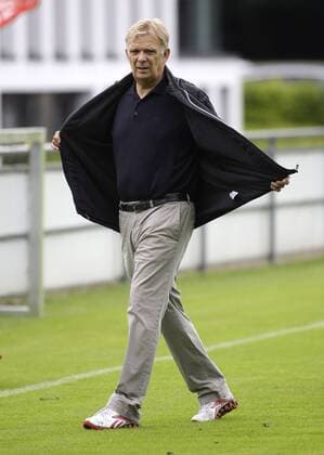 Manager Volker FINKE takes of his jacket during the training session of the 1.FC Koeln, Geissbockheim in Koeln on June 22., 2011. Mika