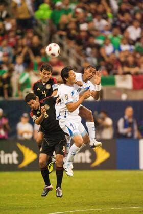 June 22, 2011 - Houston, Texas, U.S - Honduras Soccer Team Roger Espinoza (17), Mexico Soccer Team Israel Castro (8), and Rafael Marquez (4) all leap in the air for the ball. Mexico defeated Honduras 2-0 in overtime. CONCACAF Gold Cup 2011 - Honduras vs Mexico - ZUMAq99