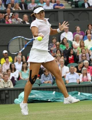 Germany s Sabine Lisicki returns the ball in her match on the fourth day of the 125th Wimbledon Championships in Wimbledon, England on Thursday, June 23, 2011.  LON2011062335 o0 Aktion Einzelbild Freisteller