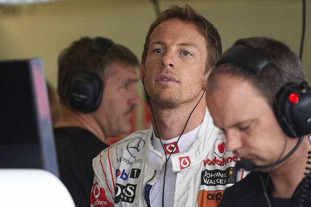 24.06.2011 Formula 1 Grand Prix from the Valencia Street Circuit in Spain. British driver Jenson Button in the McLaren box prior to the first practice session classification xXaumexOllerosx  ActionPlus11186553 Content restricted for UK based newspaper