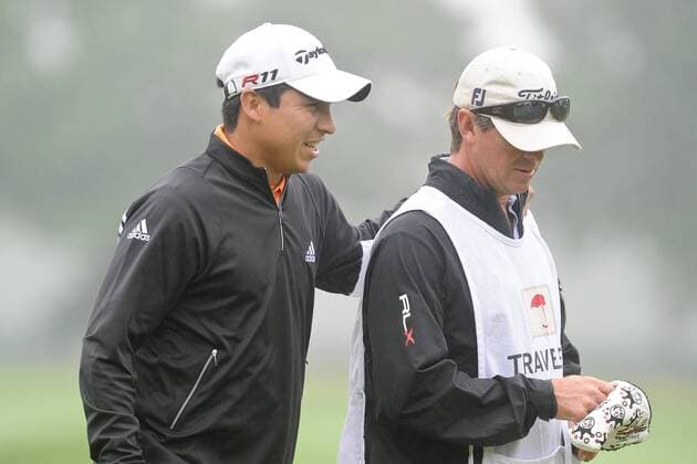 June 24, 2011 - Cromwell, Connecticut, U.S - Andres Romero pats his caddie on the back after finishing his first round with a 6 under. First round play resumed at the Travelers Championship on Friday at 7am. PGA Golf Herren 2011 - Jun 24 - Travelers Championship First Round - ZUMAq39