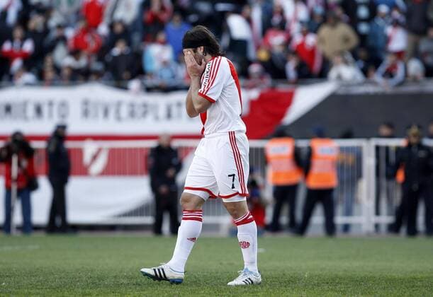 BUENOS AIRES, - River Plate s Mariano Pavone reacts after missing a penalty kick during their Argentina s first division second leg playoff soccer match in Buenos Aires, capital of Argentina, June 26, 2011. River Plate, the giant Argentine league club, suffered their biggest humiliation ever with relegation to the second division for the first time in the first leg of their play-off on Wednesday and tying 1-1 in the second leg match on Sunday. --- 