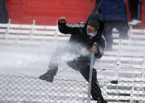 BUENOS AIRES, - A River Plate fan is stopped by water cannon after their Argentina s first division second leg playoff soccer match in Buenos Aires, capital of Argentina, June 26, 2011. River Plate, the giant Argentine league club, suffered their biggest humiliation ever with relegation to the second division for the first time in the first leg of their play-off on Wednesday and tying 1-1 in the second leg match on Sunday. ---  o0 Krawalle Randale Randalierer Ausschreitungen Fanausschreitungen