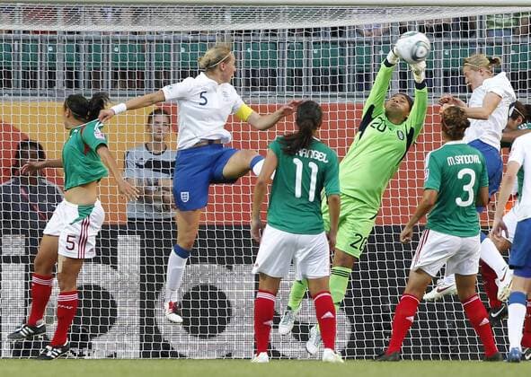 Wolfsburg - Mexican goalkeeper Cecilia Santiago (3rd R) saves the ball during the first round Group B match against England at the FIFA Women s World Cup Germany 2011 at the Arena im Allerpark in Wolfsburg, north Germany, June 27, 2011. The match ended in a 1-1 draw. (Xinhua Ding Xu)(wjd) GERMANY-FIFA WOMEN S WORLD CUP-GROUP B-MEX VS ENG 