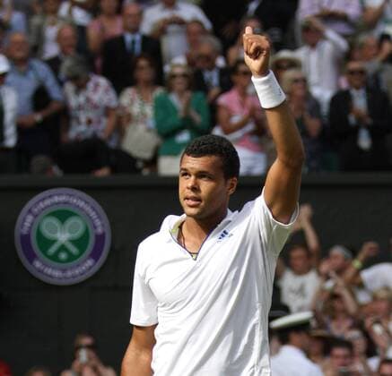 France s Jo-Wilfried Tsonga celebrates his victory on the ninth day of the 125th Wimbledon Championships in Wimbledon, on Wednesday, June 29, 2011.  LON2011062901