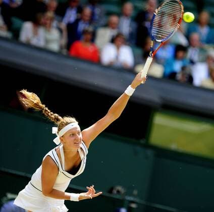 Petra Kvitova of Czech Republic serves during her final match in 2011 Wimbledon Championships in London, Britain, July 22, 2011. 