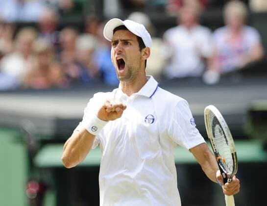 LONDON,July 3, 2011 -- Novak Djokovic of Serbia celebrates during the final of men s singles in 2011 Wimbledon tennis championships in London July 3, 2011. 
