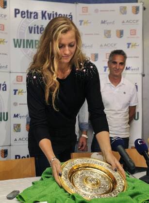 Czech tennis player Petra Kvitova, who won ladies singles final at the All England Lawn Tennis Championships at Wimbledon, poses with the trophy after her presser in Prostejov on Monday, July 4, 2011. (CTKxPhoto VladislavxGalgonek)  CTKPhoto87201107040618501