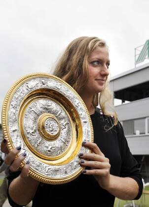 Czech tennis player Petra Kvitova, who won ladies singles final at the All England Lawn Tennis Championships at Wimbledon, poses with the trophy after her presser in Prostejov on Monday, July 4, 2011. (CTKxPhoto VladislavxGalgonek)  CTKPhoto8201107040646001