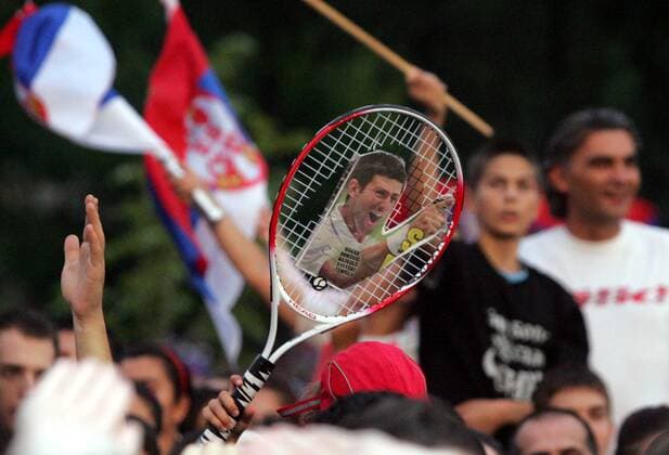 04.07.2011 Belgrade(Serbia) Novak Djokovic Wimbledon championships trophy celebration in front of Serbian parliament. :  o0 fan