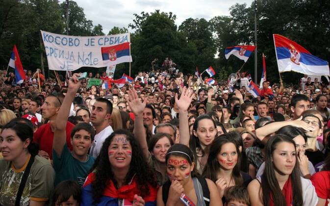 04.07.2011 Belgrade(Serbia) Hundert thousands of younger Serbian celebrate Novak Djokovic Wibledon championships trophy in front of Serbian parliament.Behind om left side flag Kosovo is Serbia :  o0 fan Totale