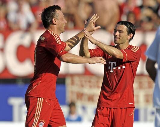 09.07.2011, Fußball 1.Bundesliga, Trainingslager FC Bayern München in Arco (Trentino, Gardasee), Testspiel FC Bayern München - Nationalmannschaft Katar. Torjubel, v.li: Ivica Olic (München), Danijel Pranjic (München).
