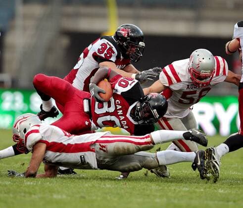 AMERICAN FOOTBALL - IFAF WM 2011, CAN vs AUT GRAZ,AUSTRIA,11.JUL.11 - DIVERS, AMERICAN FOOTBALL - IFAF Weltmeisterschaft, Länderspiel, Kanada vs Österreich. Bild zeigt David Stevens, Jahmeek Murray (CAN) und Michael Bauer (AUT). 