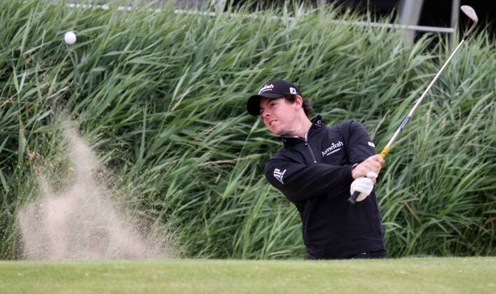 Northern Ireland s Rory McIlroy plays a bunker shot in the 140th Open Championship at Royal St Georges Golf club in Sandwich,England on Tuesday, July 12, 2011.  LON2011071203