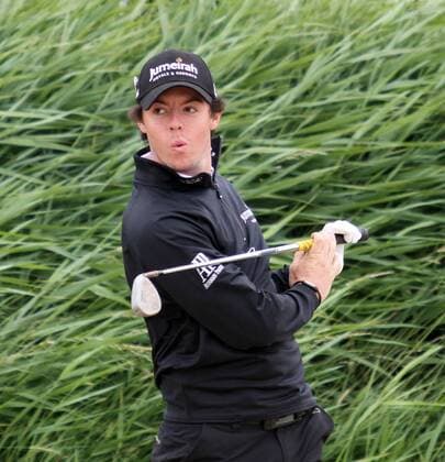 Northern Ireland s Rory McIlroy plays in the rough in the 140th Open Championship at Royal St Georges Golf club in Sandwich,England on Tuesday, July 12, 2011.  LON2011071204