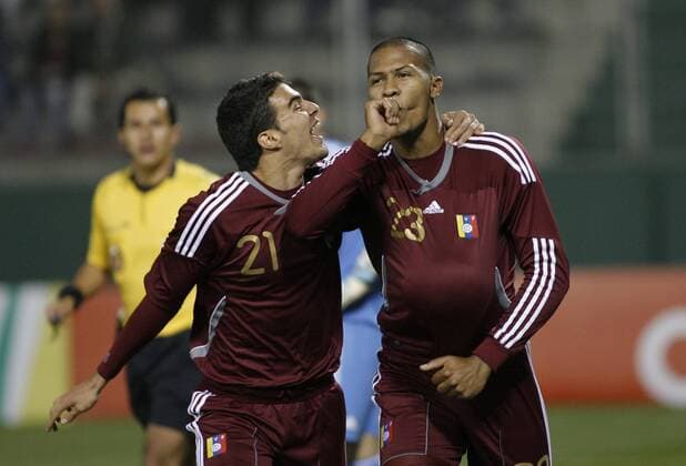 Venezuela s Salomon Rondon (R) and Alexander Gonzalez celebrate victory against Paraguay during the match for the group stage of Copa America 2011, in Salta 