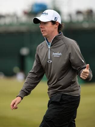 Northern Ireland s Rory McIlroy reacts after a bogey on the 1st hole on the first day of the 140th Open Championship at Royal St Georges Golf club in Sandwich, England on Thursday, July 14, 2011.  LON2011071403