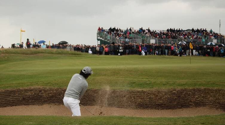 Japan s Ryo Ishikawa hits out of the bunker on the first day of the 140th Open Championship at Royal St Georges Golf club in Sandwich, England on Thursday, July 14, 2011.  LON2011071405