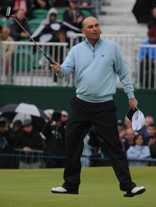 Denmark s Thomas Bjorn celebrates a five under par round on the 18th green on the first day of the 140th Open Championship at Royal St Georges Golf club in Sandwich, England on Thursday, July 14, 2011.  LON2011071416