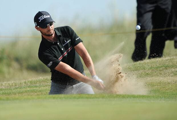 Golf - The Open 2011 - Royal St George s - Day 2 Kyle Stanley (USA) chips out of a bunker on the 7th at Royal St George s, Sandwich 