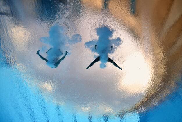 Wu Minxia (L) and He Zi of China compete in the preliminary round of the women s 3m synchronized springboard diving event at the 14th FINA World Championships in Shanghai, east China, July 16, 2011. Wu Minxia and He Zi of China claimed the goldmedal of the event. 